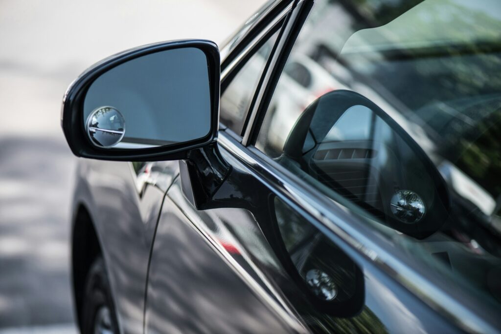 close up view of shiny black car background